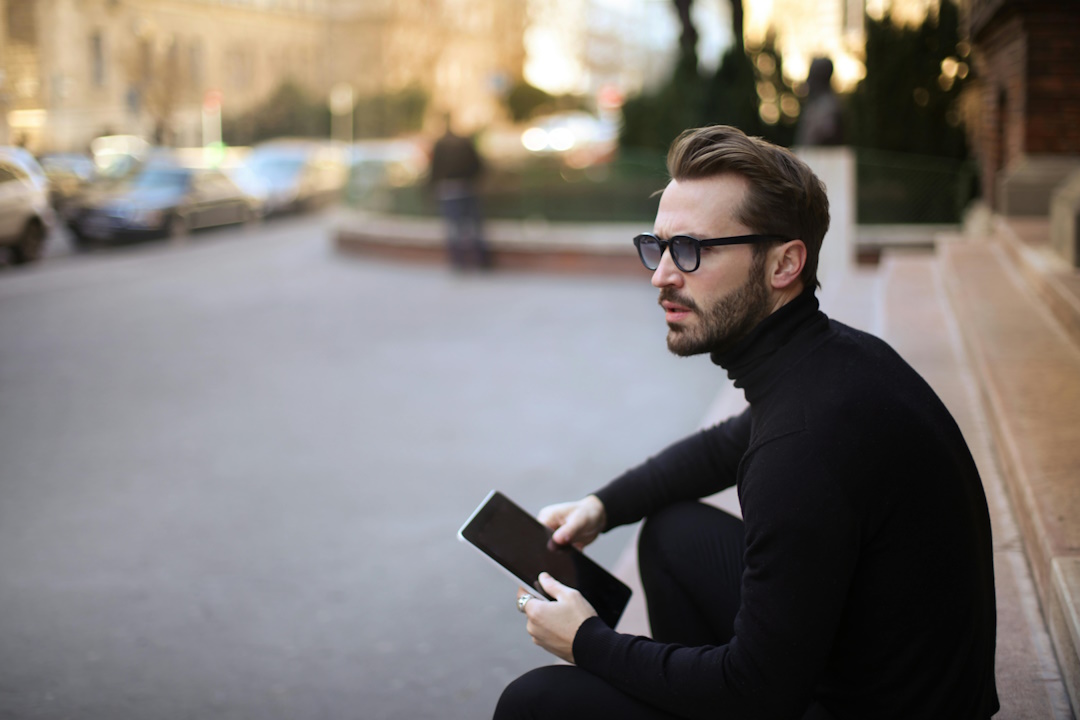 Troubled thinking location independent earning man (source: Pexels)